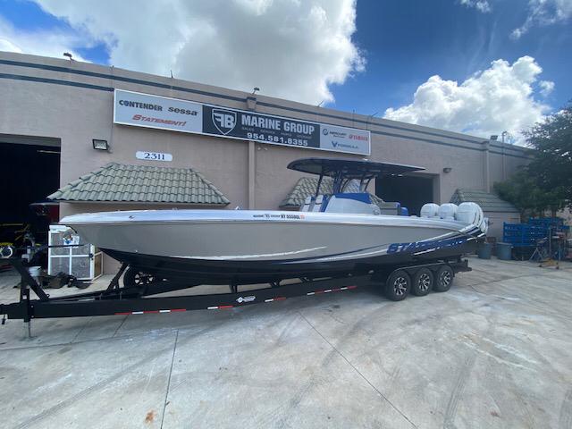 A boat is stationed in front of a garage